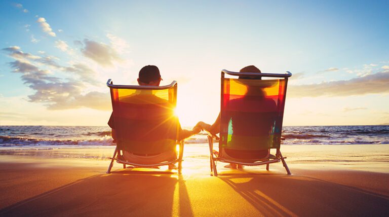 Retired Couple Enjoying Sunset on the Beach